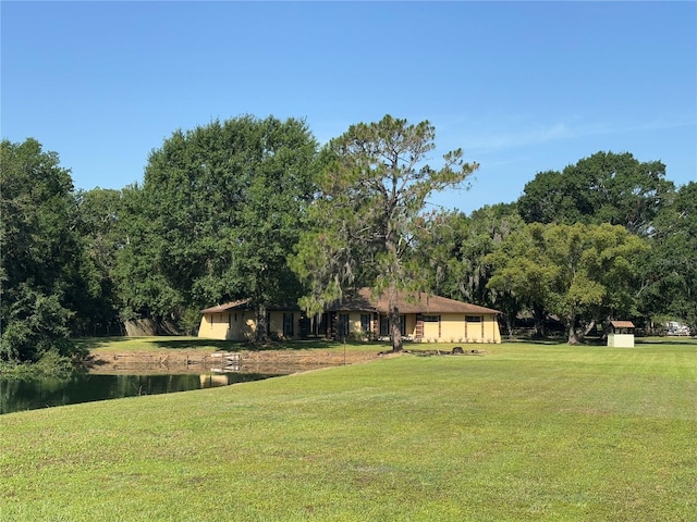 4101 N Forbes Rd, Plant City, FL 33565 - view of green lawn featuring a water view and a forest view
