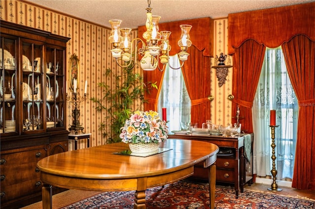 4101 N Forbes Rd, Plant City, FL 33565 - carpeted dining area with a chandelier, a textured ceiling, crown molding, and wallpapered walls