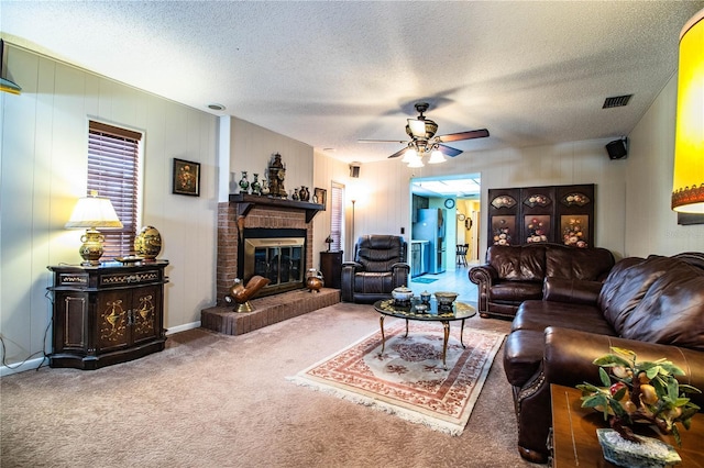 4101 N Forbes Rd, Plant City, FL 33565 - living area with ceiling fan, carpet flooring, a fireplace, and a textured ceiling