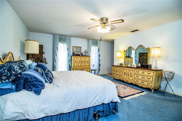 4101 N Forbes Rd, Plant City, FL 33565 - bedroom with carpet, a textured ceiling, and a ceiling fan