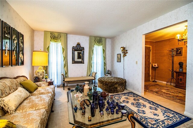 4101 N Forbes Rd, Plant City, FL 33565 - living room with a textured ceiling, a chandelier, tile patterned floors, and wallpapered walls