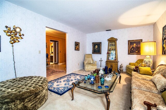 4101 N Forbes Rd, Plant City, FL 33565 - carpeted living area with a textured ceiling and wallpapered walls