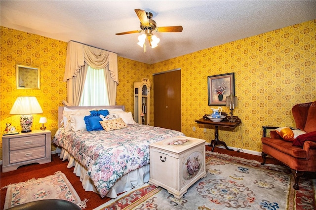 4101 N Forbes Rd, Plant City, FL 33565 - bedroom featuring wallpapered walls, a textured ceiling, ceiling fan, and baseboards