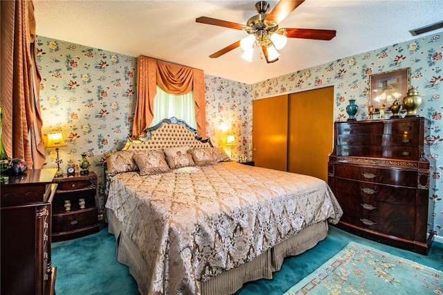 4101 N Forbes Rd, Plant City, FL 33565 - carpeted bedroom with wallpapered walls, a closet, ceiling fan, and a textured ceiling