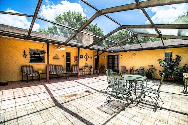 4101 N Forbes Rd, Plant City, FL 33565 - view of patio / terrace with glass enclosure, ceiling fan, and outdoor dining space