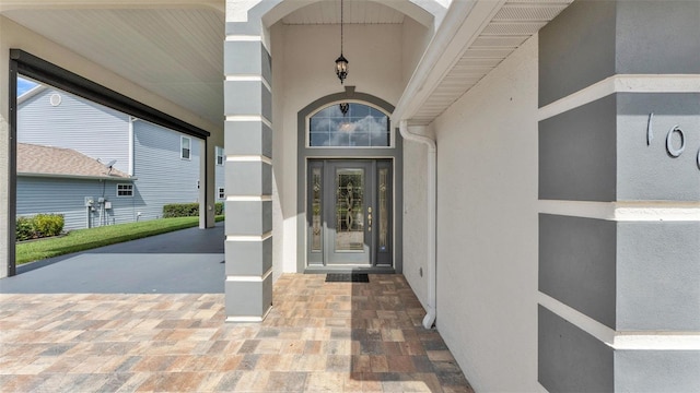 1062 Rally Dr, Polk City, FL 33868 - view of exterior entry with stucco siding