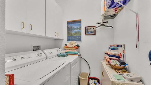 1062 Rally Dr, Polk City, FL 33868 - clothes washing area with washing machine and clothes dryer and cabinet space