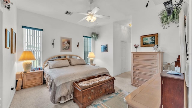 1062 Rally Dr, Polk City, FL 33868 - bedroom featuring visible vents, baseboards, ceiling fan, and light colored carpet