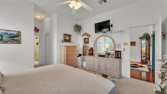1062 Rally Dr, Polk City, FL 33868 - bedroom featuring visible vents, a ceiling fan, and light colored carpet