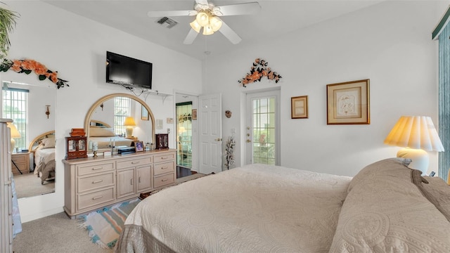 1062 Rally Dr, Polk City, FL 33868 - bedroom with light carpet, ceiling fan, multiple windows, and visible vents