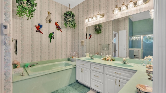 1062 Rally Dr, Polk City, FL 33868 - bathroom featuring a sink, a bath, double vanity, and wallpapered walls