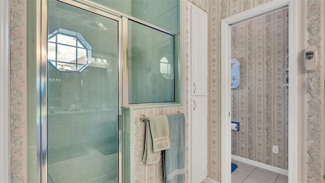 1062 Rally Dr, Polk City, FL 33868 - full bath with tile patterned floors, baseboards, wallpapered walls, and a stall shower