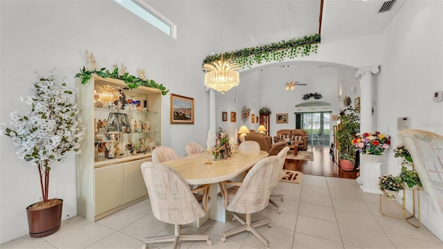 1062 Rally Dr, Polk City, FL 33868 - dining area with visible vents, a high ceiling, light tile patterned flooring, and a healthy amount of sunlight