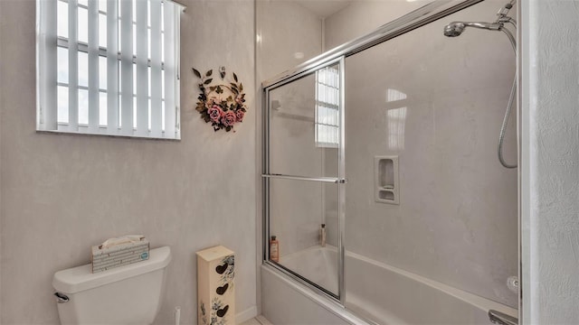 1062 Rally Dr, Polk City, FL 33868 - full bathroom with bath / shower combo with glass door and toilet