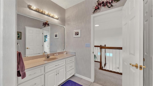 1062 Rally Dr, Polk City, FL 33868 - bathroom with tile patterned floors, vanity, and baseboards