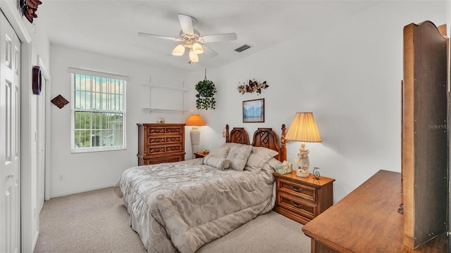 1062 Rally Dr, Polk City, FL 33868 - bedroom with a closet, baseboards, visible vents, ceiling fan, and carpet
