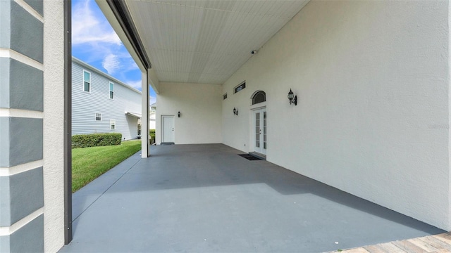 1062 Rally Dr, Polk City, FL 33868 - view of patio / terrace with french doors and an attached carport