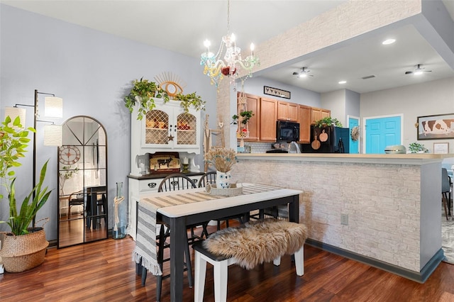 2125 Wild Grape Pl, Riverview, FL 33578 - dining area featuring dark wood-type flooring and a chandelier