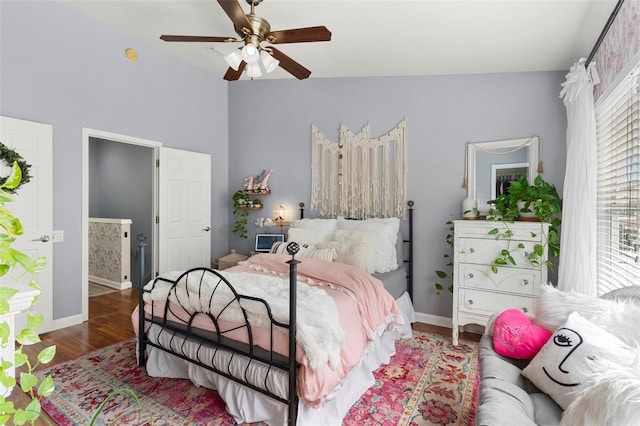 2125 Wild Grape Pl, Riverview, FL 33578 - bedroom with wood finished floors, vaulted ceiling, and a ceiling fan