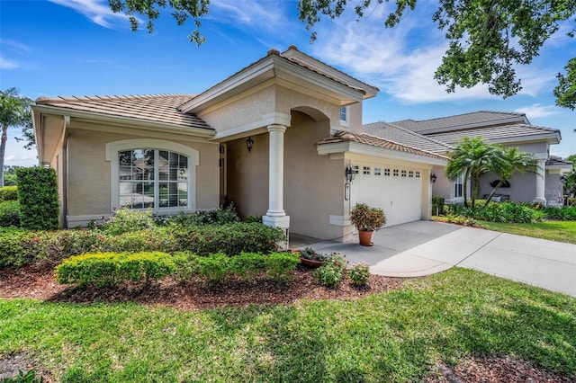 mediterranean / spanish-style house featuring stucco siding, a tile roof, driveway, and a garage