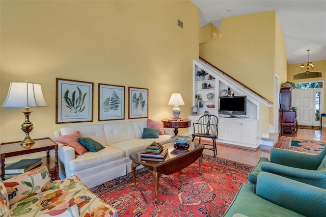 living area featuring wood finished floors and a high ceiling