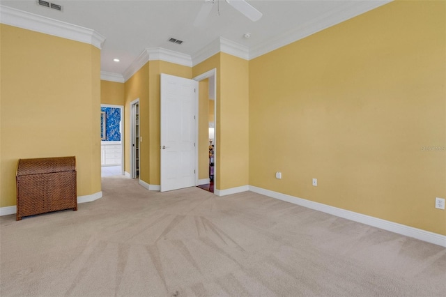 carpeted spare room featuring recessed lighting, visible vents, ornamental molding, baseboards, and ceiling fan