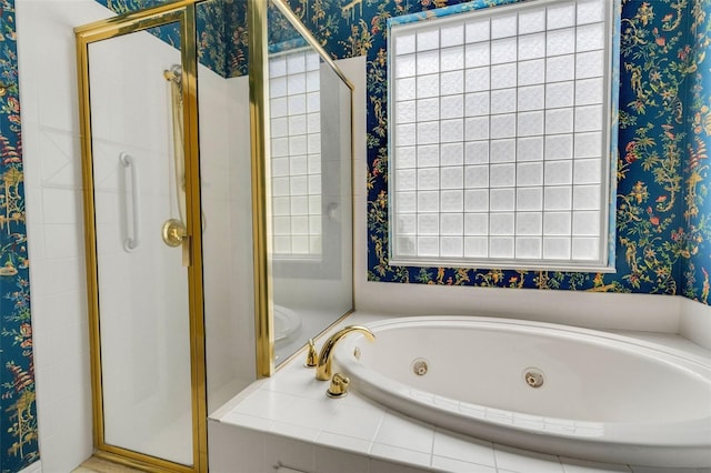 full bath featuring wallpapered walls, a jetted tub, and a stall shower