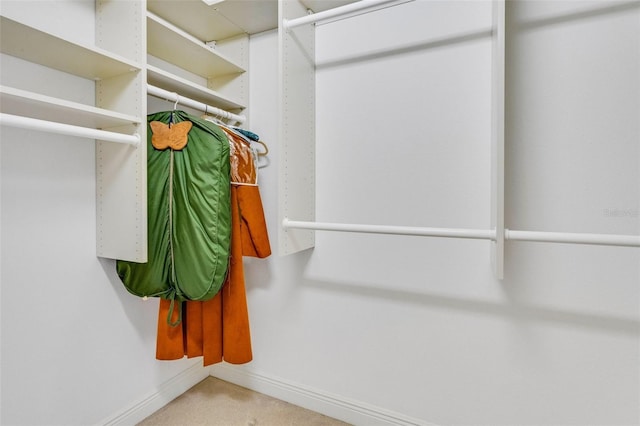 walk in closet featuring carpet