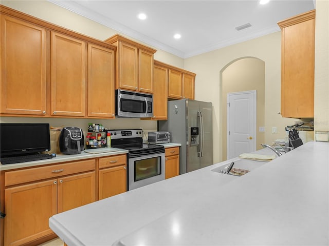 3300 Hawks Ridge Dr, Lakeland, FL 33810 - kitchen with stainless steel appliances, a sink, light countertops, ornamental molding, and recessed lighting