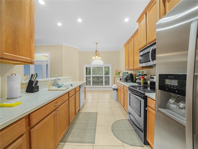 3300 Hawks Ridge Dr, Lakeland, FL 33810 - kitchen featuring stainless steel appliances, a sink, light countertops, ornamental molding, and recessed lighting