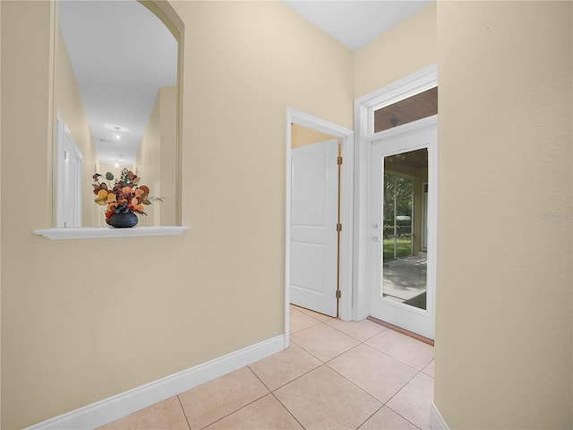 3300 Hawks Ridge Dr, Lakeland, FL 33810 - hallway featuring light tile patterned flooring, baseboards, and arched walkways