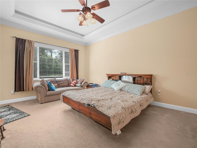 3300 Hawks Ridge Dr, Lakeland, FL 33810 - carpeted bedroom featuring a raised ceiling, ornamental molding, baseboards, and a ceiling fan