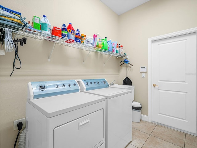 3300 Hawks Ridge Dr, Lakeland, FL 33810 - washroom featuring independent washer and dryer and light tile patterned floors