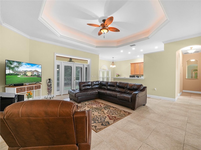 3300 Hawks Ridge Dr, Lakeland, FL 33810 - living area with a raised ceiling, ornamental molding, ceiling fan, arched walkways, and light tile patterned flooring