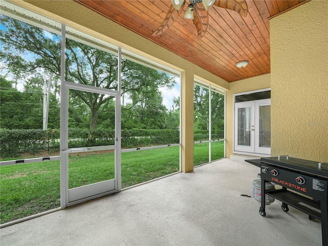 3300 Hawks Ridge Dr, Lakeland, FL 33810 - sunroom with ceiling fan, french doors, and view of scattered trees