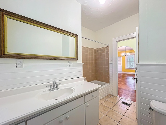 full bathroom with vanity, tile patterned floors, toilet, visible vents, and shower / bathing tub combination