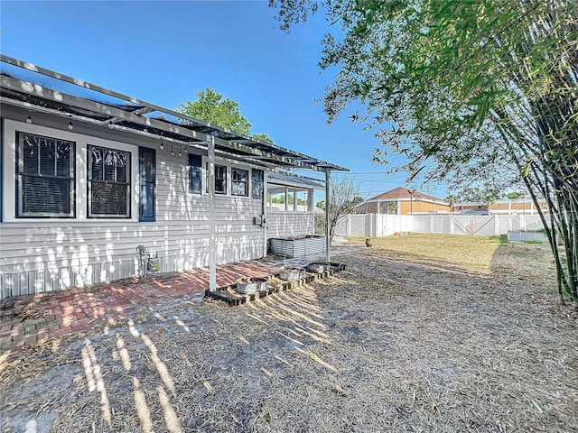 exterior space with a patio, central AC, and fence