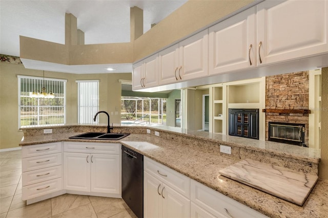 12301 Jim Edwards Rd, Haines City, FL 33844 - kitchen with dishwasher, a sink, light stone counters, healthy amount of natural light, and a high ceiling