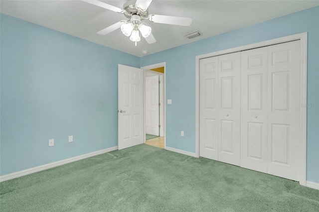 12301 Jim Edwards Rd, Haines City, FL 33844 - unfurnished bedroom featuring carpet, baseboards, a closet, and ceiling fan