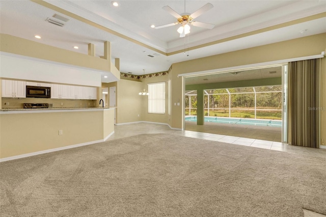 12301 Jim Edwards Rd, Haines City, FL 33844 - unfurnished living room featuring light colored carpet, a ceiling fan, baseboards, light tile patterned flooring, and recessed lighting