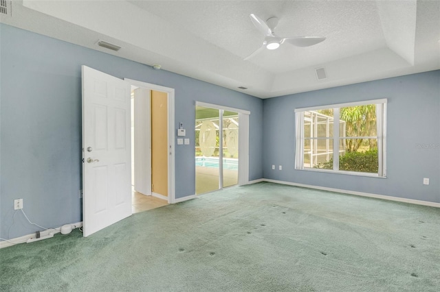 12301 Jim Edwards Rd, Haines City, FL 33844 - unfurnished room with carpet floors, a ceiling fan, baseboards, and a textured ceiling