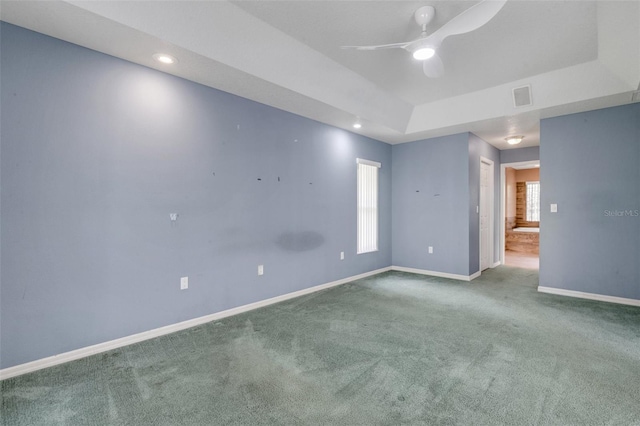 12301 Jim Edwards Rd, Haines City, FL 33844 - carpeted spare room featuring baseboards, a ceiling fan, a tray ceiling, and recessed lighting