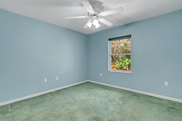 12301 Jim Edwards Rd, Haines City, FL 33844 - spare room featuring carpet, baseboards, and a ceiling fan