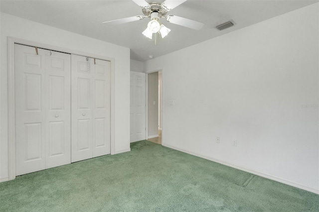 12301 Jim Edwards Rd, Haines City, FL 33844 - unfurnished bedroom featuring carpet flooring, a closet, a ceiling fan, and baseboards