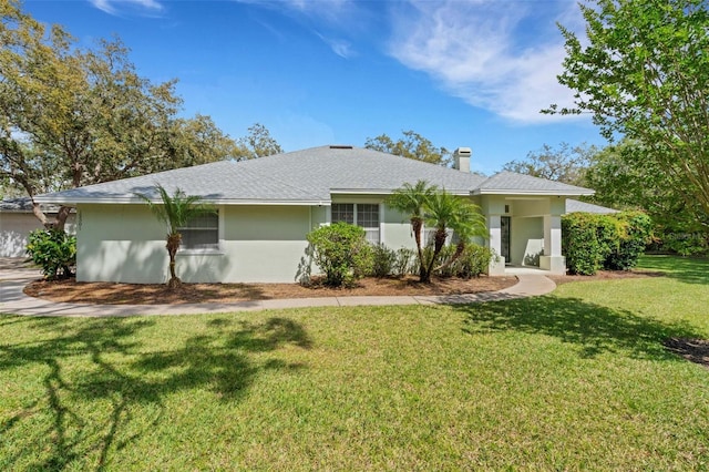 12301 Jim Edwards Rd, Haines City, FL 33844 - ranch-style home featuring a front lawn, a chimney, and stucco siding