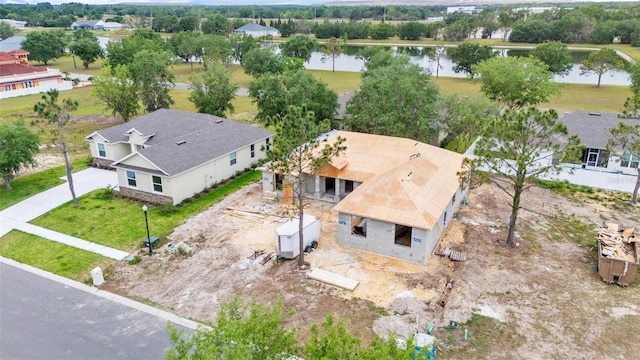 aerial view of property and surrounding area with a large body of water