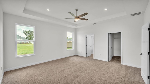 505 Shanklin Ave, Bartow, FL 33830 - unfurnished bedroom featuring a raised ceiling, light colored carpet, multiple windows, and recessed lighting