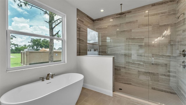 505 Shanklin Ave, Bartow, FL 33830 - full bathroom with a stall shower, a soaking tub, recessed lighting, and tile patterned flooring