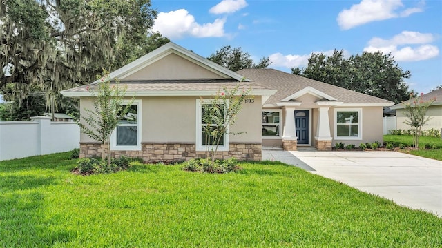 803 Allison Pl, Bartow, FL 33830 - view of front facade with stucco siding, stone siding, and a shingled roof