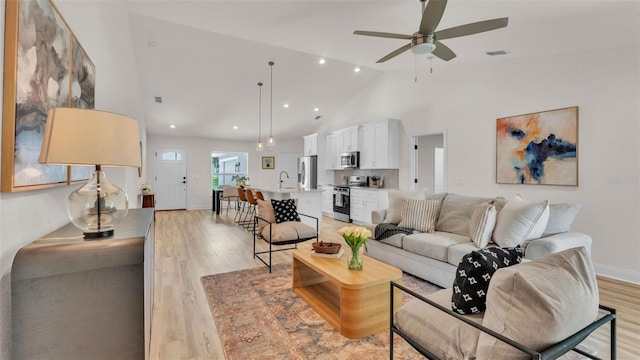 803 Allison Pl, Bartow, FL 33830 - living area featuring light wood-type flooring, ceiling fan, recessed lighting, and high vaulted ceiling